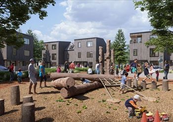 A playground with children playing and a building in the background.